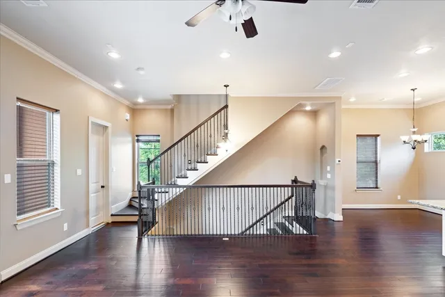 a view of entryway and hall with wooden floor