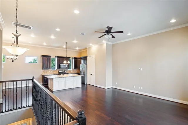 a view of kitchen with sink microwave and stove