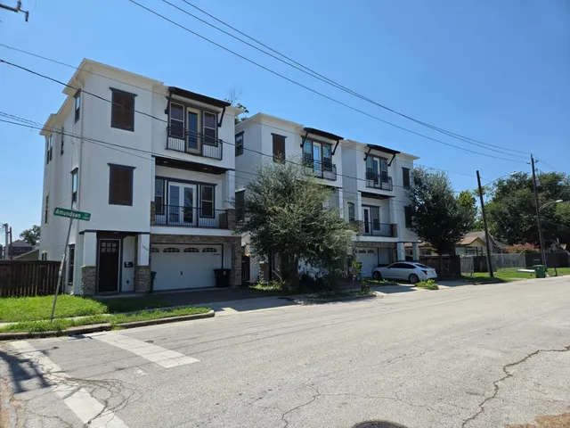 a view of a building with a yard