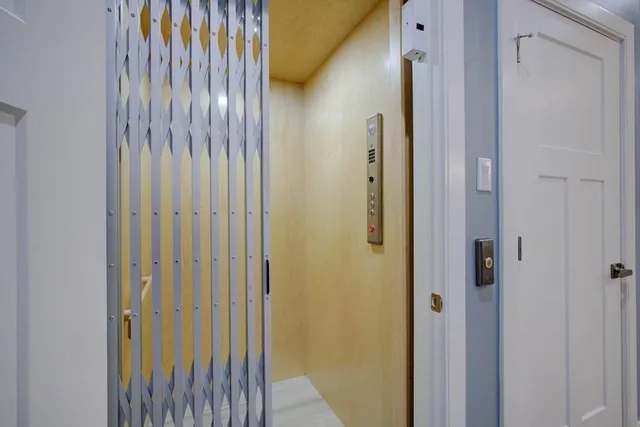 a view of a bathroom from the door