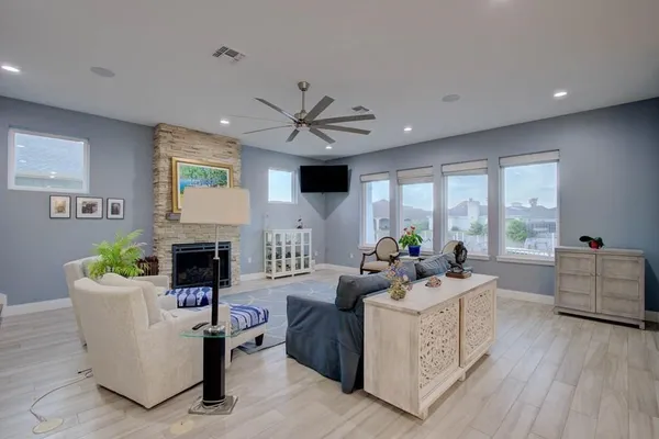 a living room with furniture and a fireplace