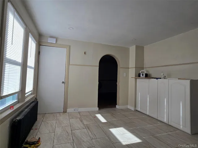 a view of empty room with windows