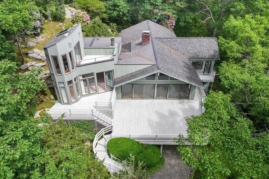 23 Ocean Street Manchester, MA 01944 - Photo 9 of 36 an aerial view of a house with a yard