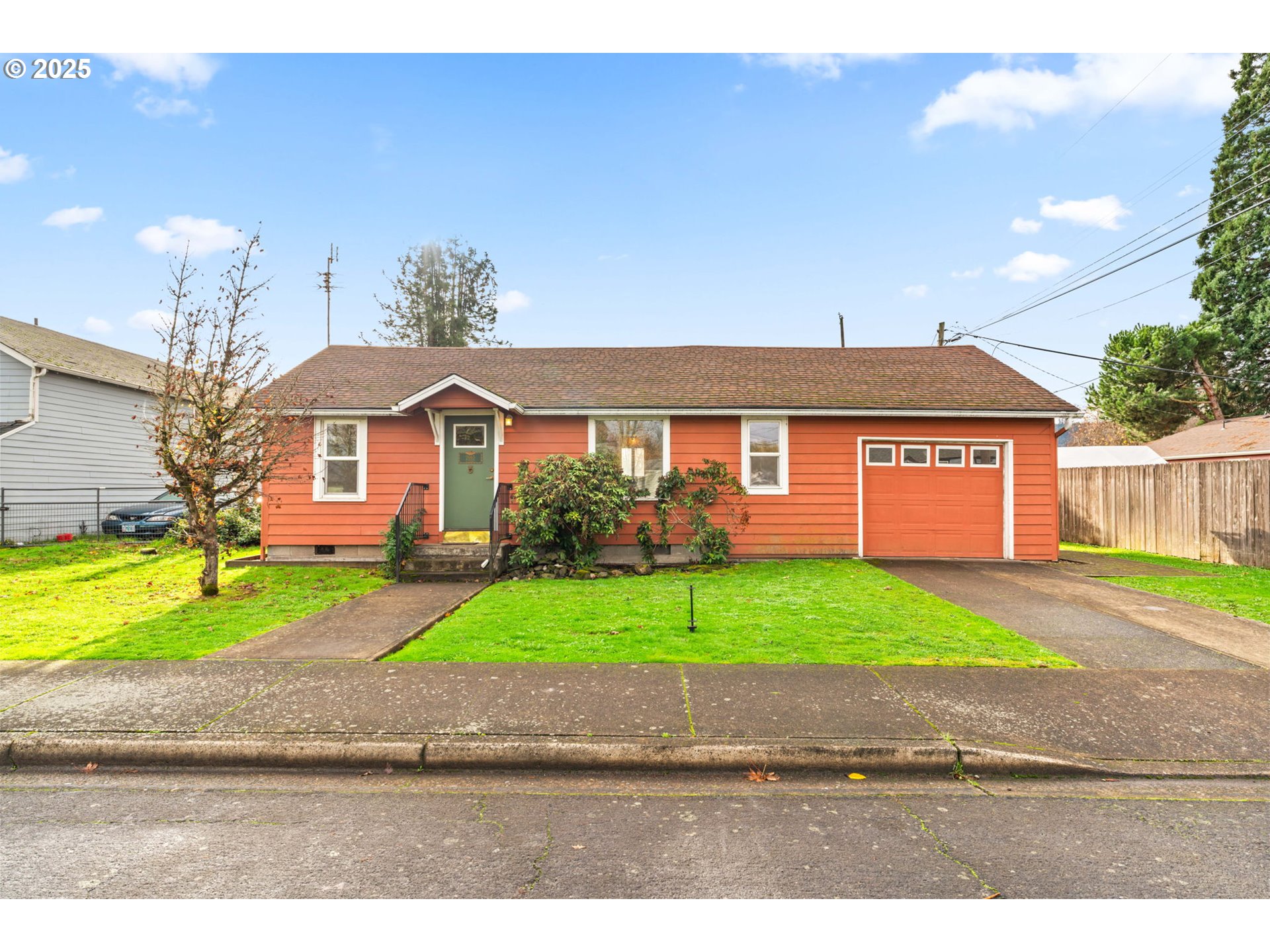 2665 C Street Springfield, OR 97477 - Photo 1 of 20 a front view of a house with a yard and a garage