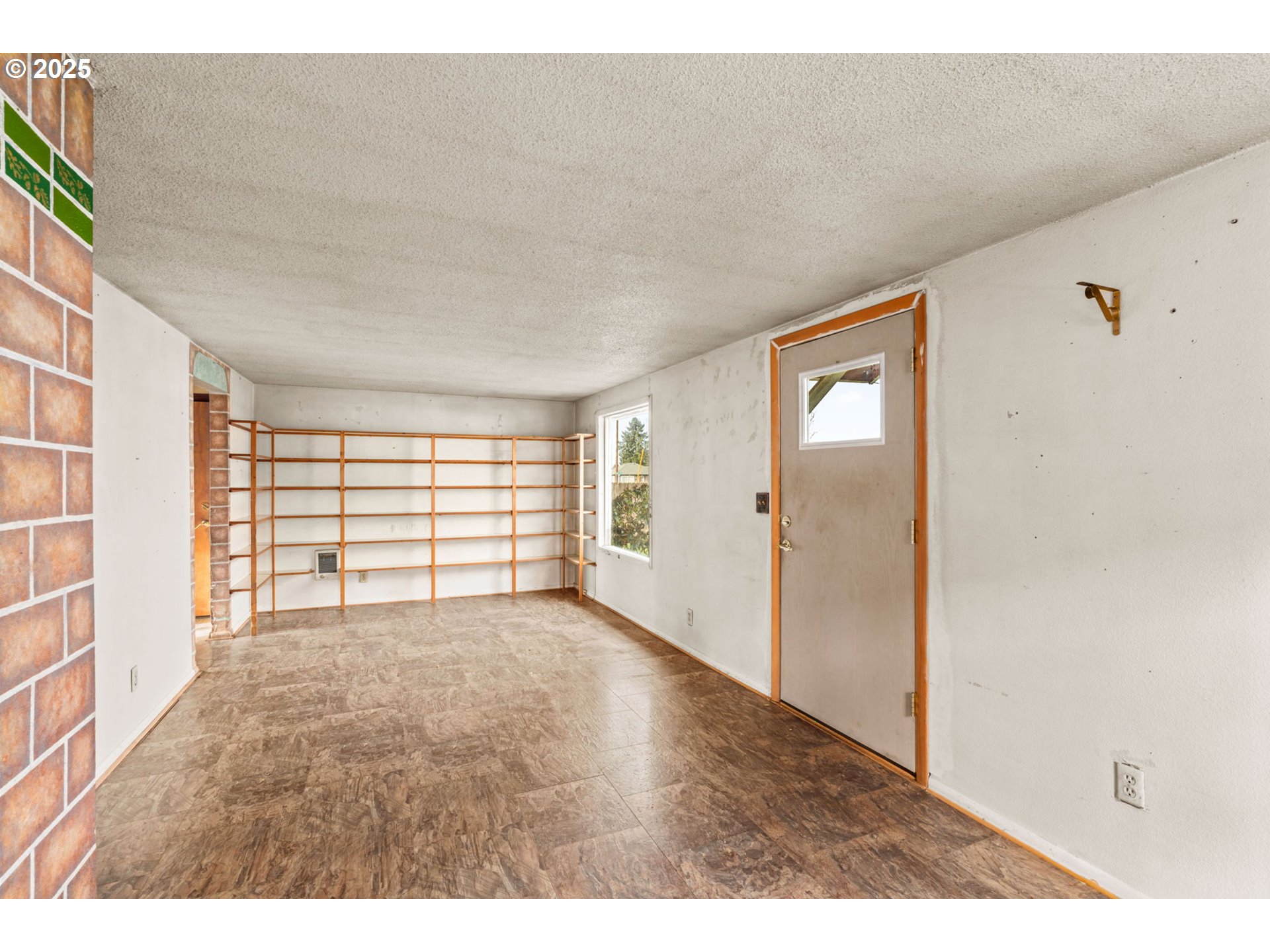 2665 C Street Springfield, OR 97477 - Photo 5 of 20 a view of an empty room with a window