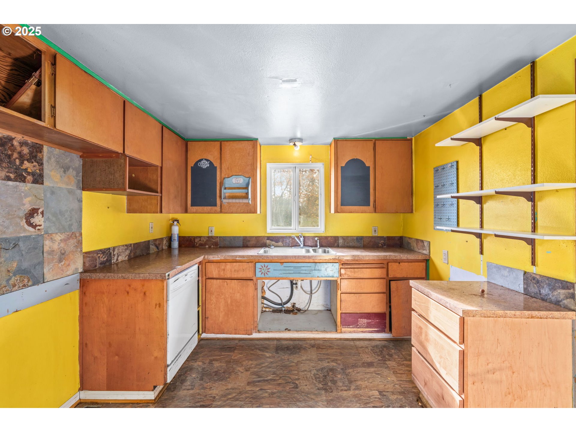2665 C Street Springfield, OR 97477 - Photo 8 of 20 a kitchen with stainless steel appliances granite countertop sink stove and granite counter top