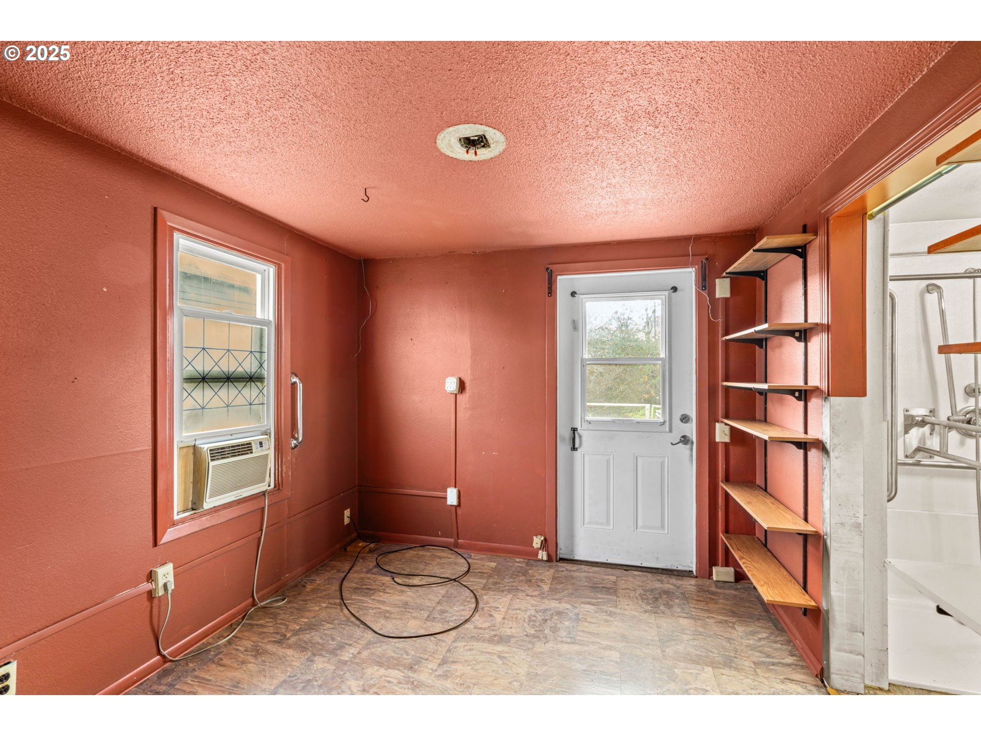 2665 C Street Springfield, OR 97477 - Photo 10 of 20 a view of an empty room with a window
