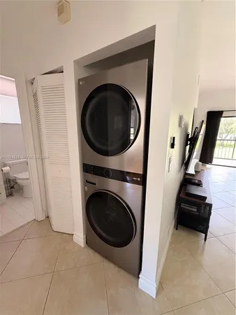 a view of a storage and utility room with washer and dryer