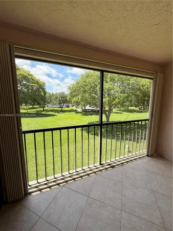 a view of a room with an outdoor seating space