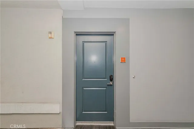 a view of a patio with dining table and chairs