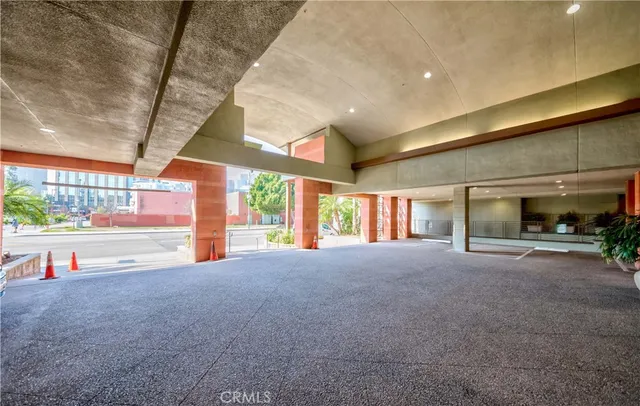 a view of a building with car parked