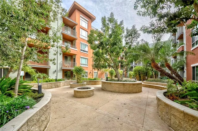 a view of a building with potted plants