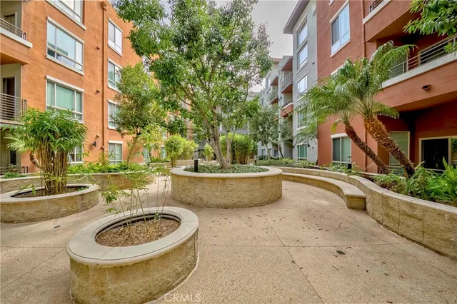 a view of a patio with a chairs and plants