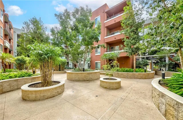a view of a building with sitting area