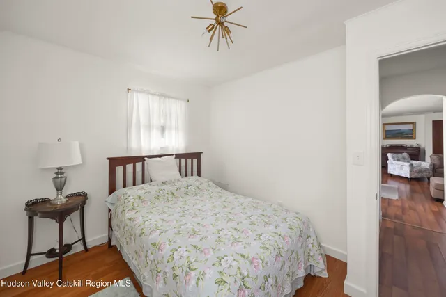 a bedroom with a bed and a table