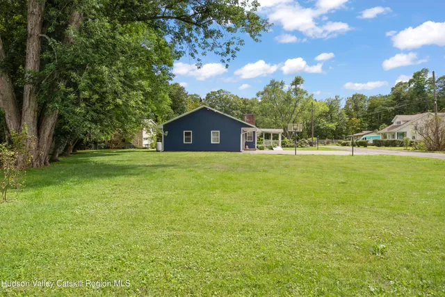 a view of a house with a big yard