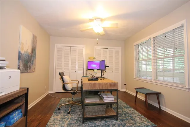 a dining room with furniture and wooden floor