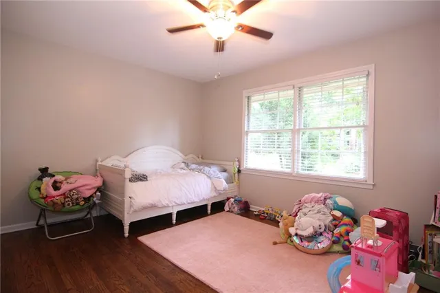a bedroom with furniture and a window