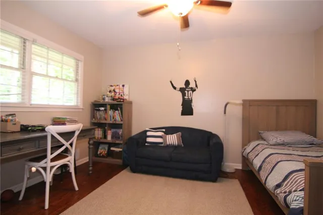 a bedroom with furniture and window