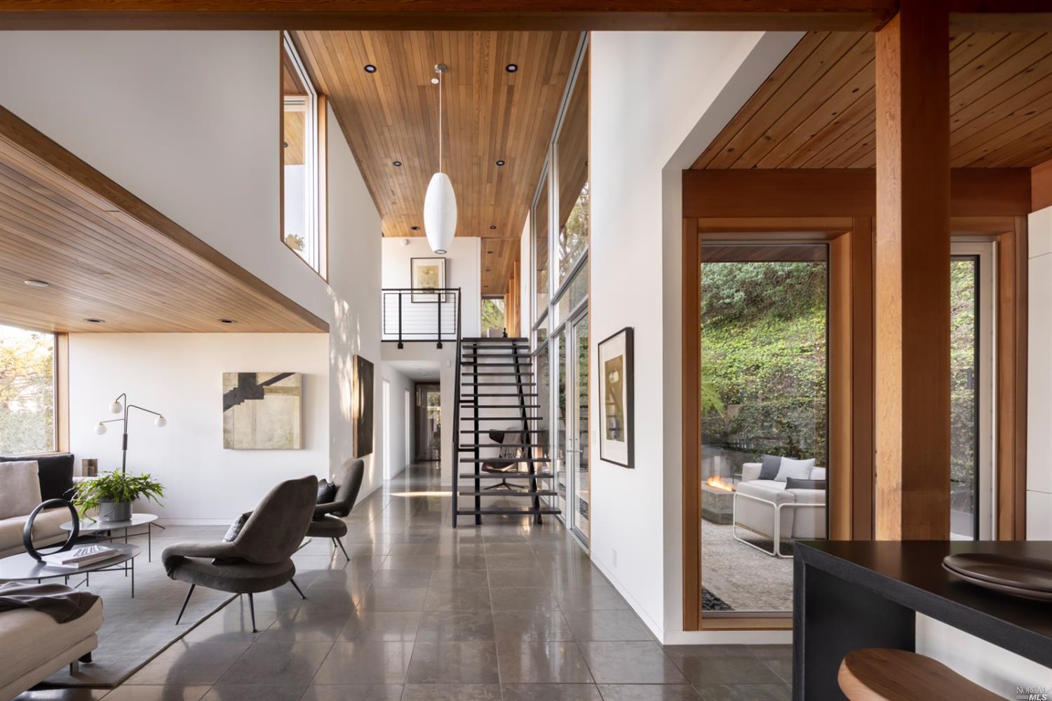 121 Toyon Lane Sausalito, CA 94965 - Photo 2 of 25 a living room with furniture and a large window