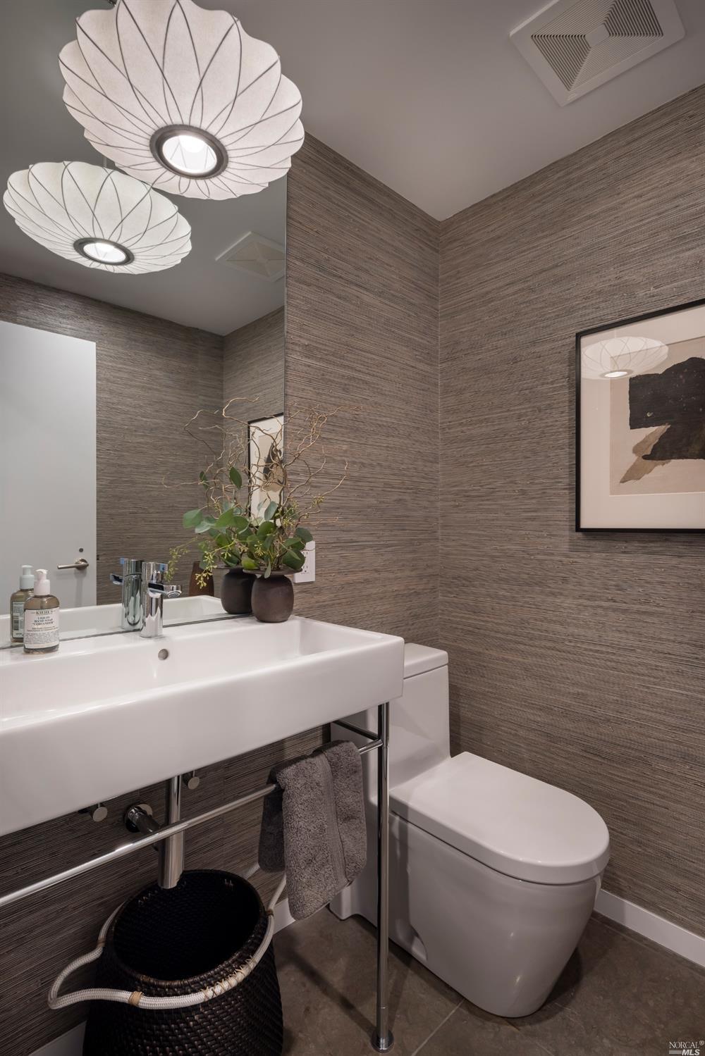 121 Toyon Lane Sausalito, CA 94965 - Photo 21 of 25 a bathroom with a sink a mirror and a toilet