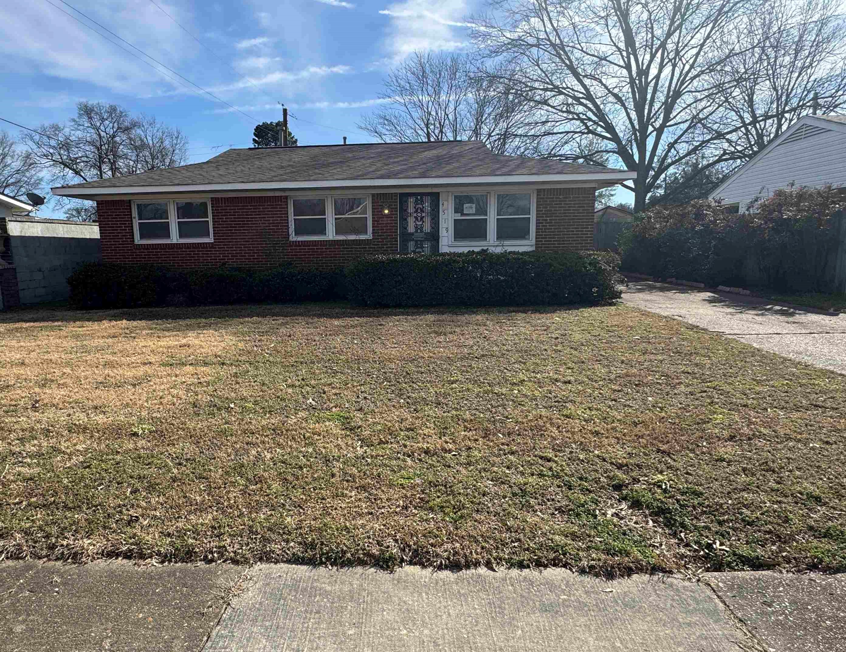 a view of house with yard