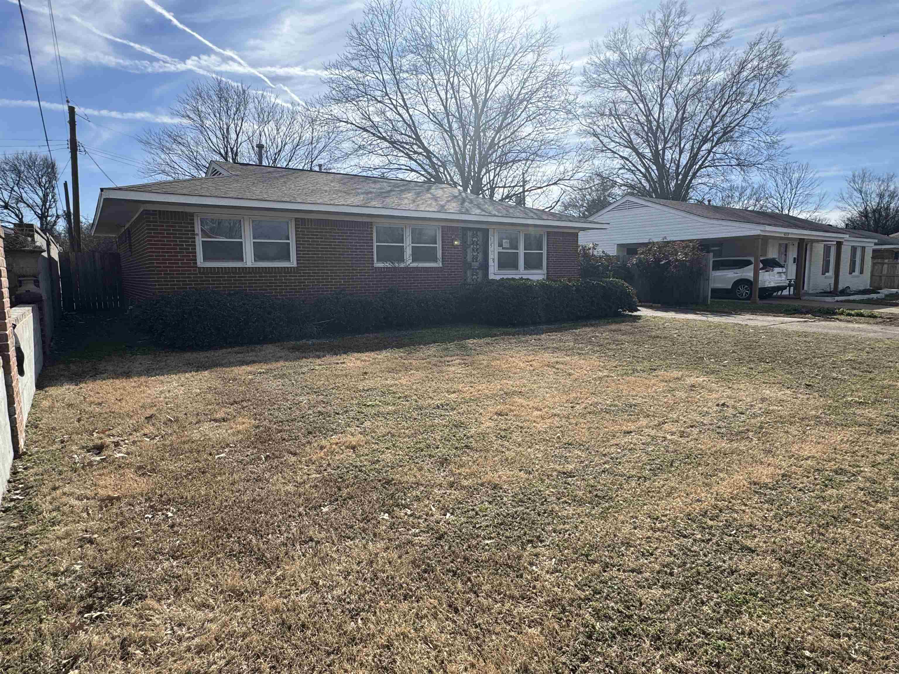 4519 Jamerson Road Memphis, TN 38122 - Photo 2 of 19 a backyard of a house with large trees and outdoor seating