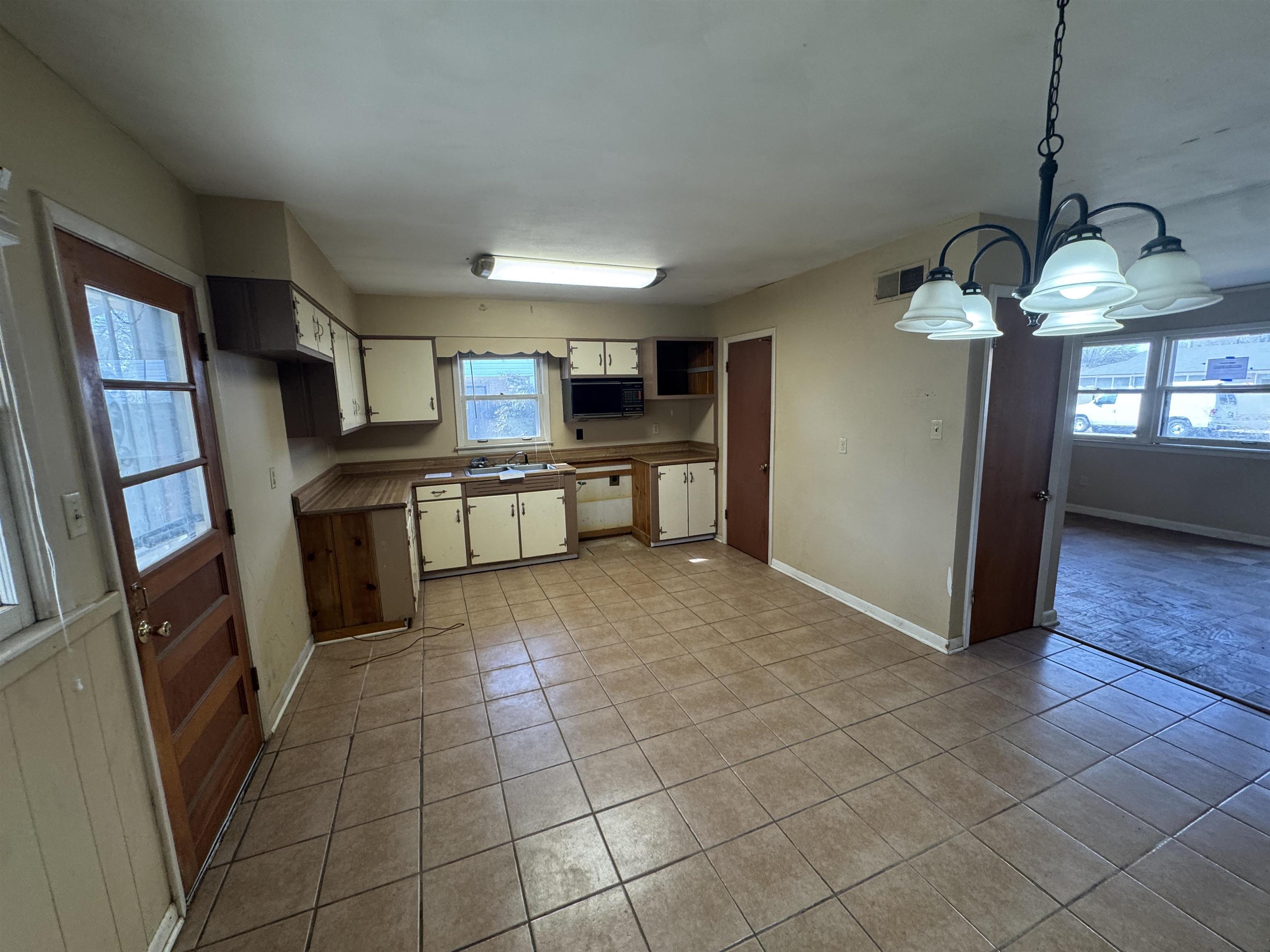 4519 Jamerson Road Memphis, TN 38122 - Photo 9 of 19 a kitchen with stainless steel appliances granite countertop a refrigerator and a sink
