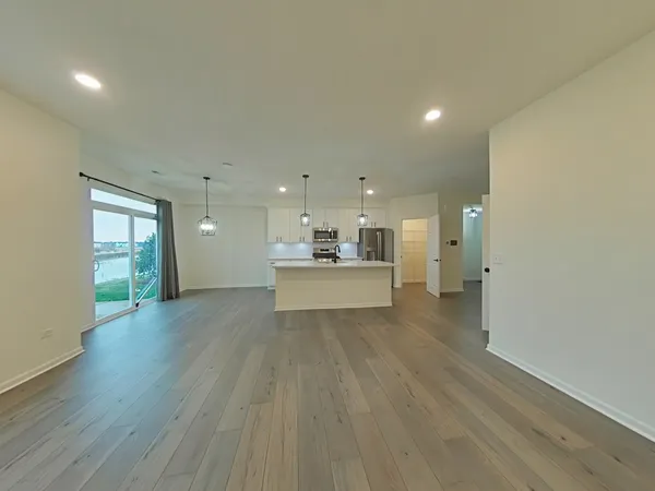 a view of a kitchen with a sink and a window