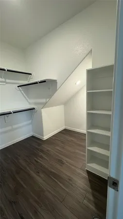 a view of an empty walk in closet