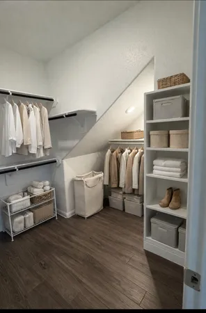 a view of an empty walk in closet
