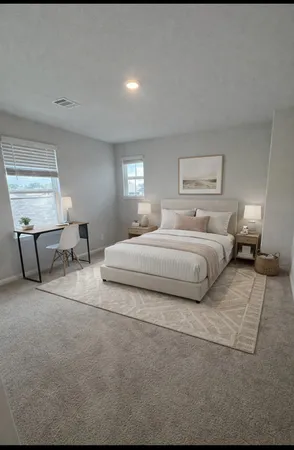 a bedroom with bed and window