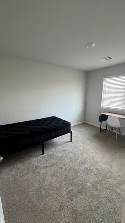 a room with furniture and a window