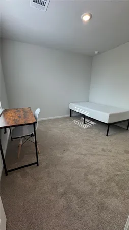 a room with a table and chairs