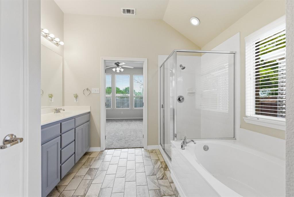 817 Huebner Way Burleson, TX 76028 - Photo 30 of 35 Another view of the primary bathroom from the walk in closet door.