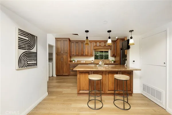 a kitchen with stainless steel appliances granite countertop a sink and cabinets
