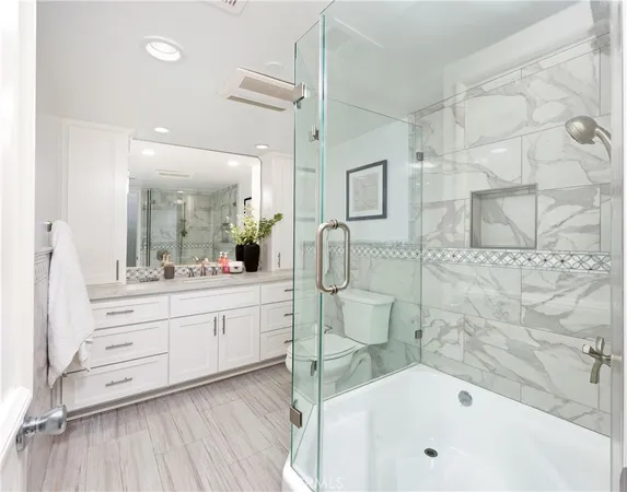 a bathroom with a bathtub and a sink