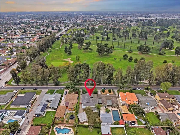 an aerial view of residential houses and outdoor space