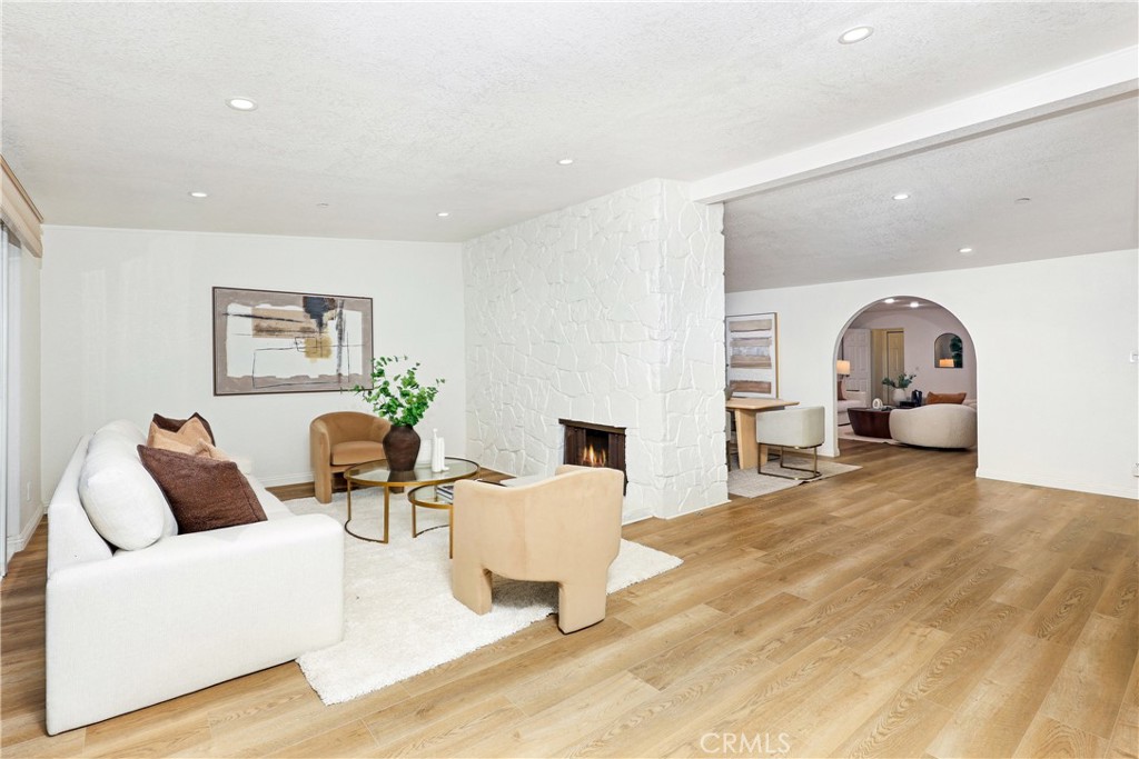 7333 Via Rio Nido Downey, CA 90241 - Photo 9 of 45 Living Room
Fire in fireplace has been virtually added for staging purposes.