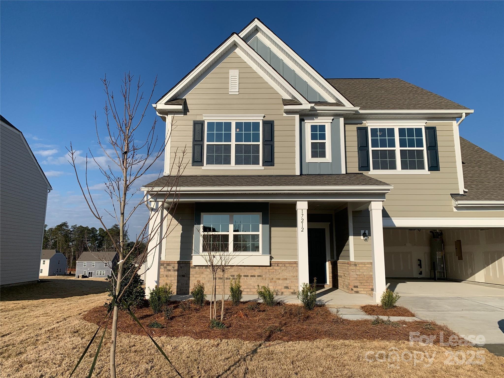 17212 Snug Harbor Drive Charlotte, NC 28278 - Photo 1 of 16 a front view of a house with a yard
