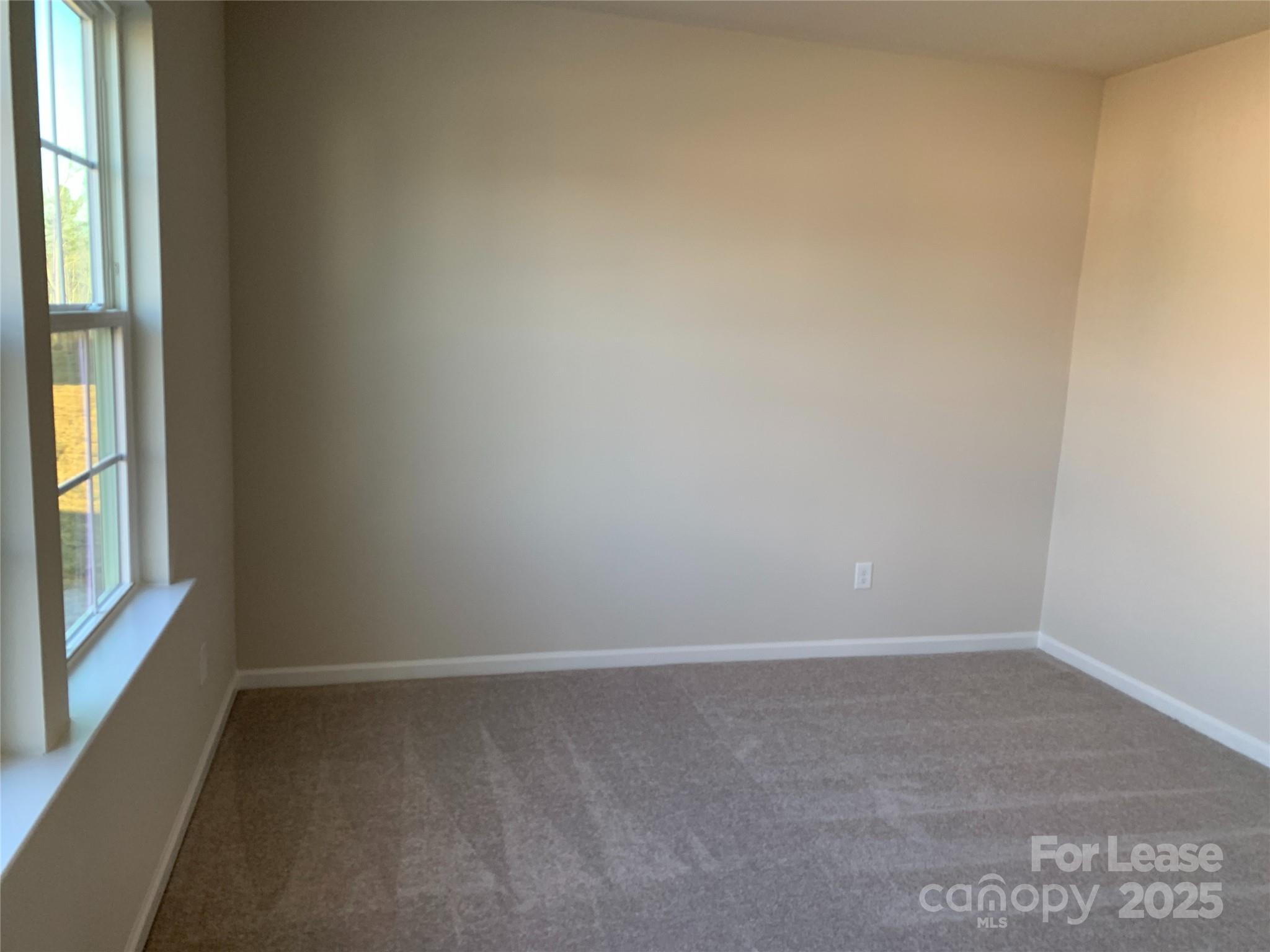 17212 Snug Harbor Drive Charlotte, NC 28278 - Photo 8 of 16 a view of an empty room and window