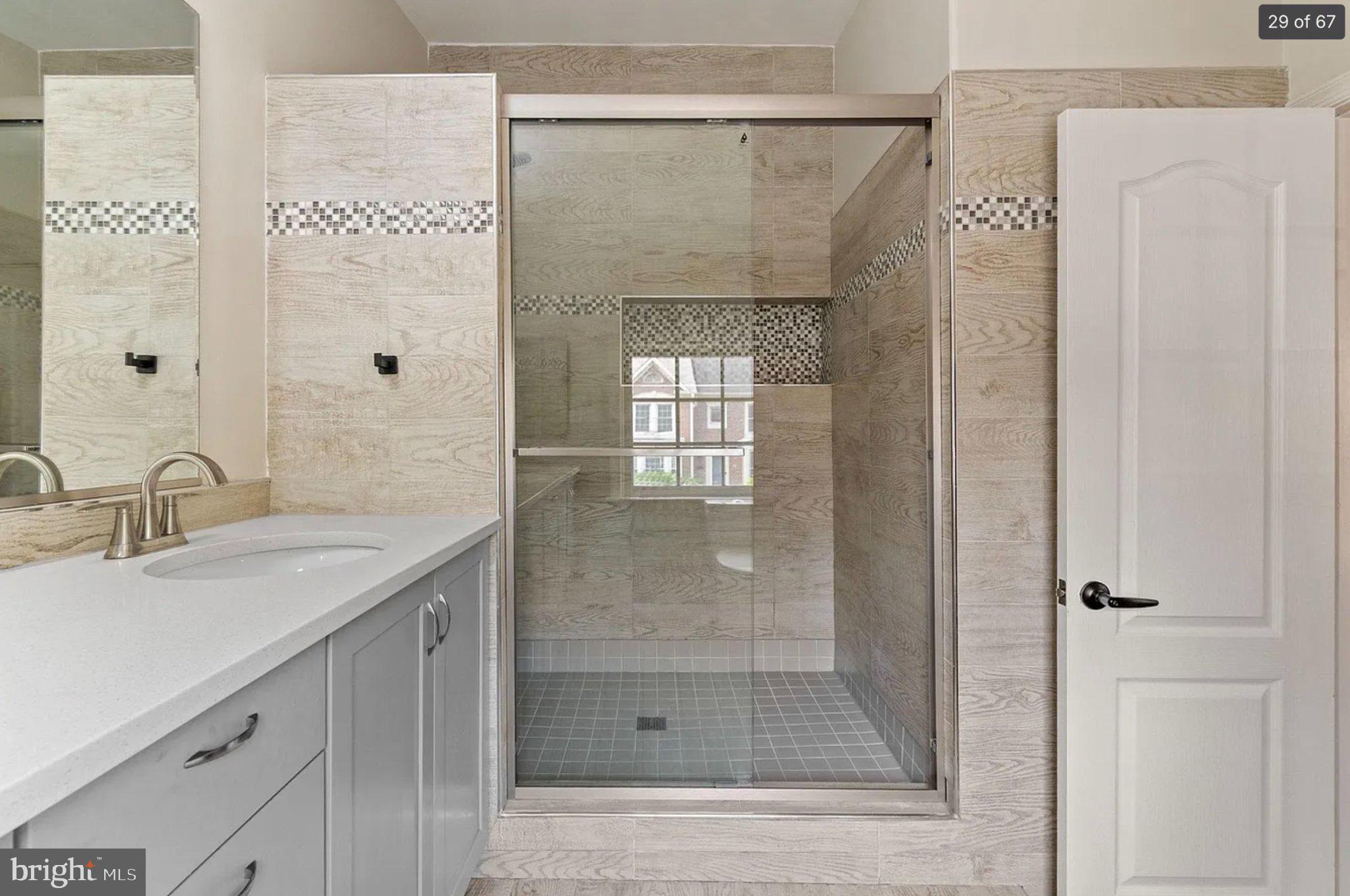 3906 Valley Ridge Drive Fairfax, VA 22033 - Photo 30 of 58 Sleek modern shower with elegant tiles.