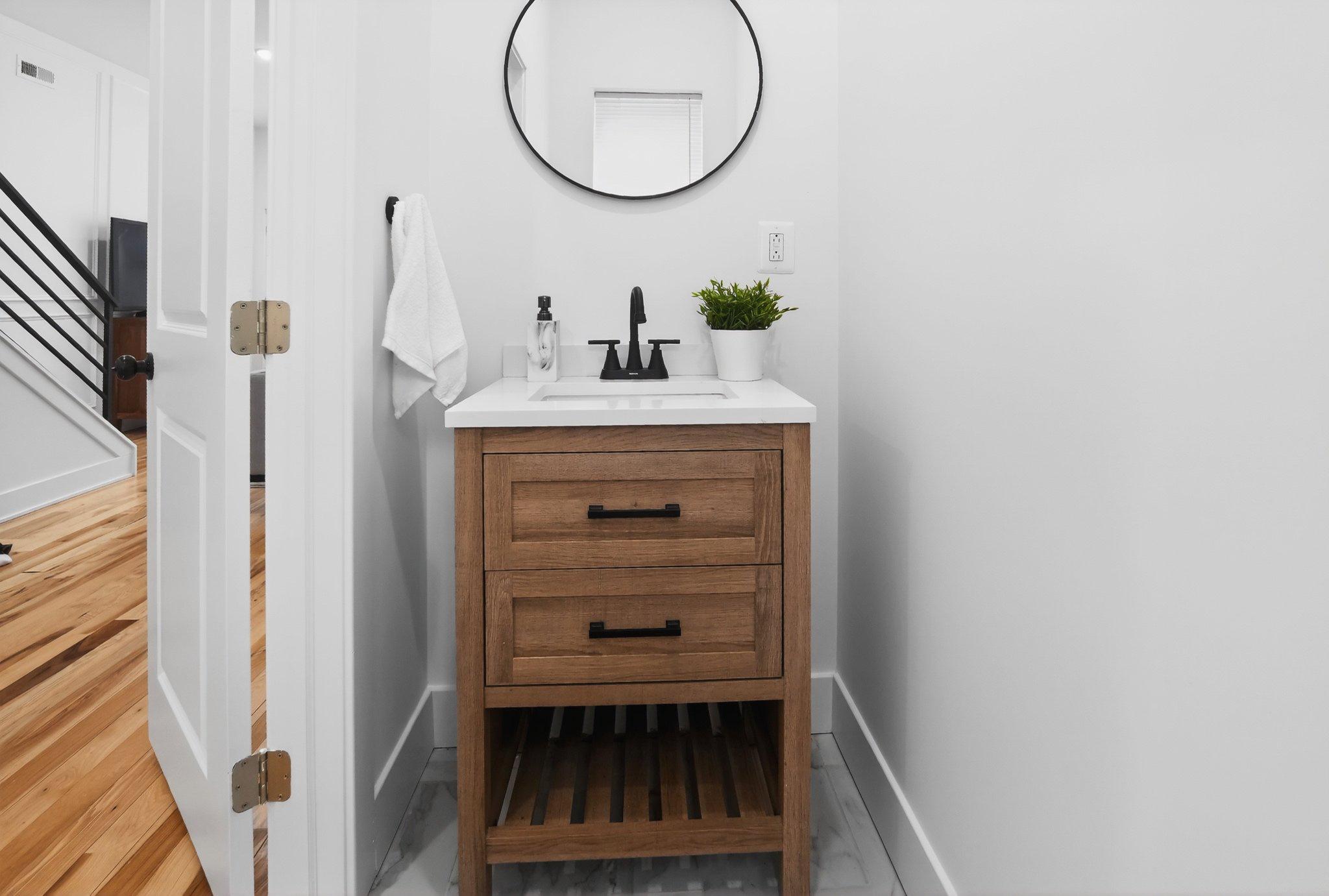 1314 South 46th Street Philadelphia, PA 19143 - Photo 14 of 56 a bathroom with a sink and a mirror