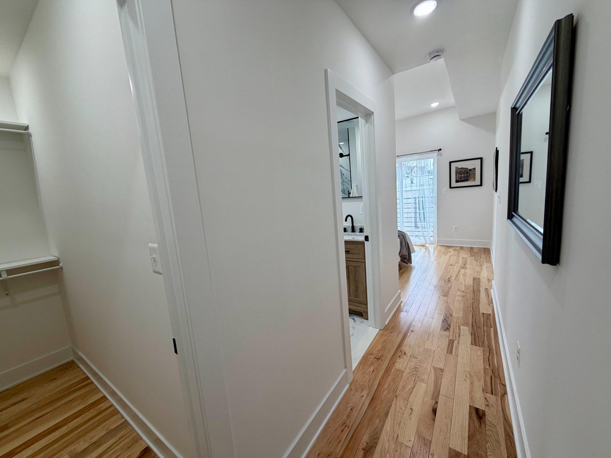 1314 South 46th Street Philadelphia, PA 19143 - Photo 24 of 56 a view of a hallway with wooden floor and staircase