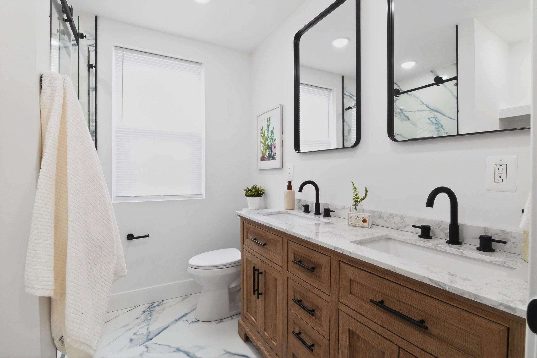1314 South 46th Street Philadelphia, PA 19143 - Photo 26 of 56 a bathroom with a double vanity sink mirror and toilet