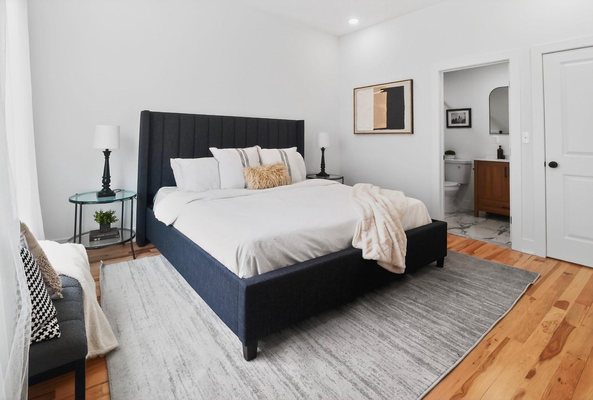1314 South 46th Street Philadelphia, PA 19143 - Photo 33 of 56 a bed sitting in a bedroom and a table