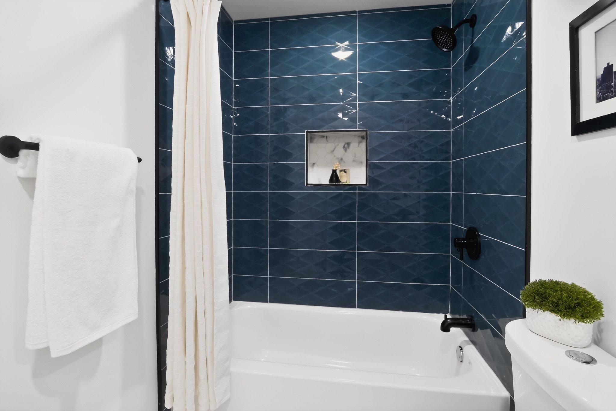 1314 South 46th Street Philadelphia, PA 19143 - Photo 35 of 56 a bathroom with a bathtub