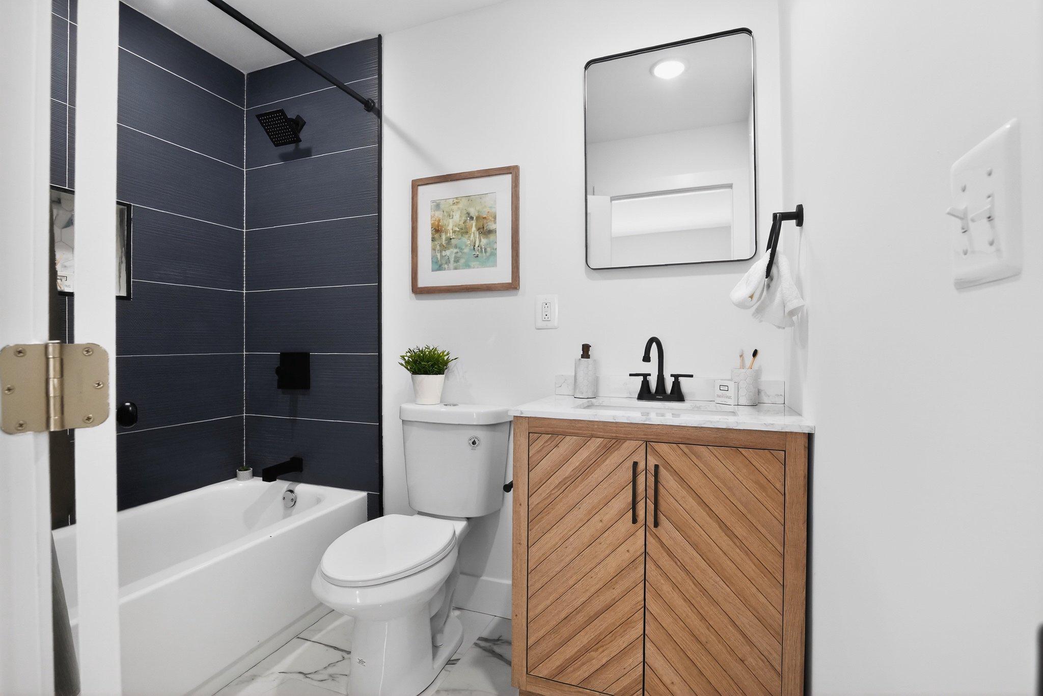 1314 South 46th Street Philadelphia, PA 19143 - Photo 44 of 56 a bathroom with a sink toilet and shower