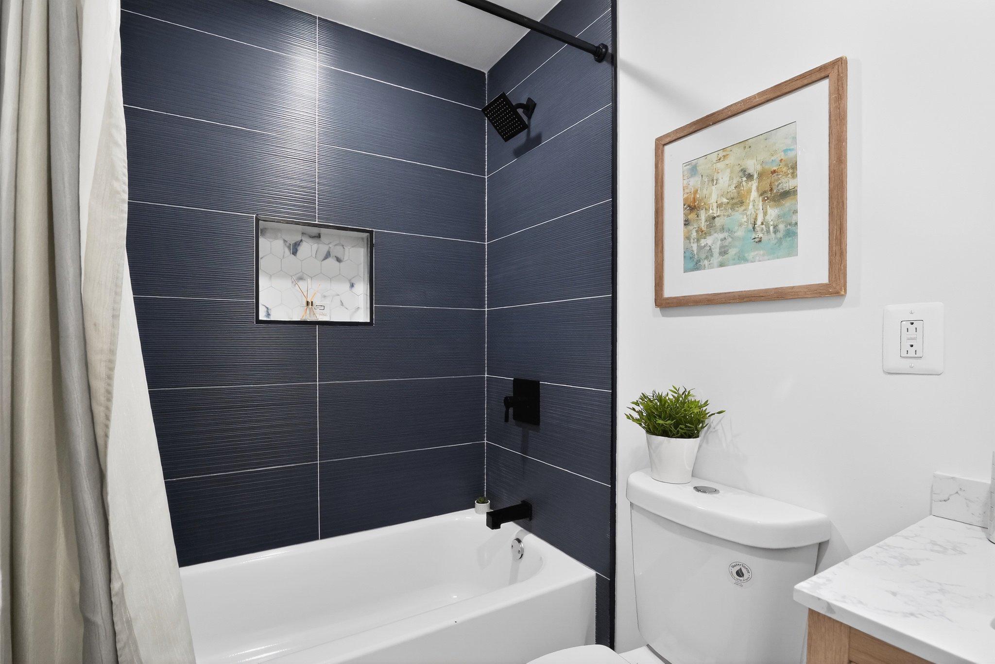 1314 South 46th Street Philadelphia, PA 19143 - Photo 45 of 56 a bathroom with a bathtub and sink
