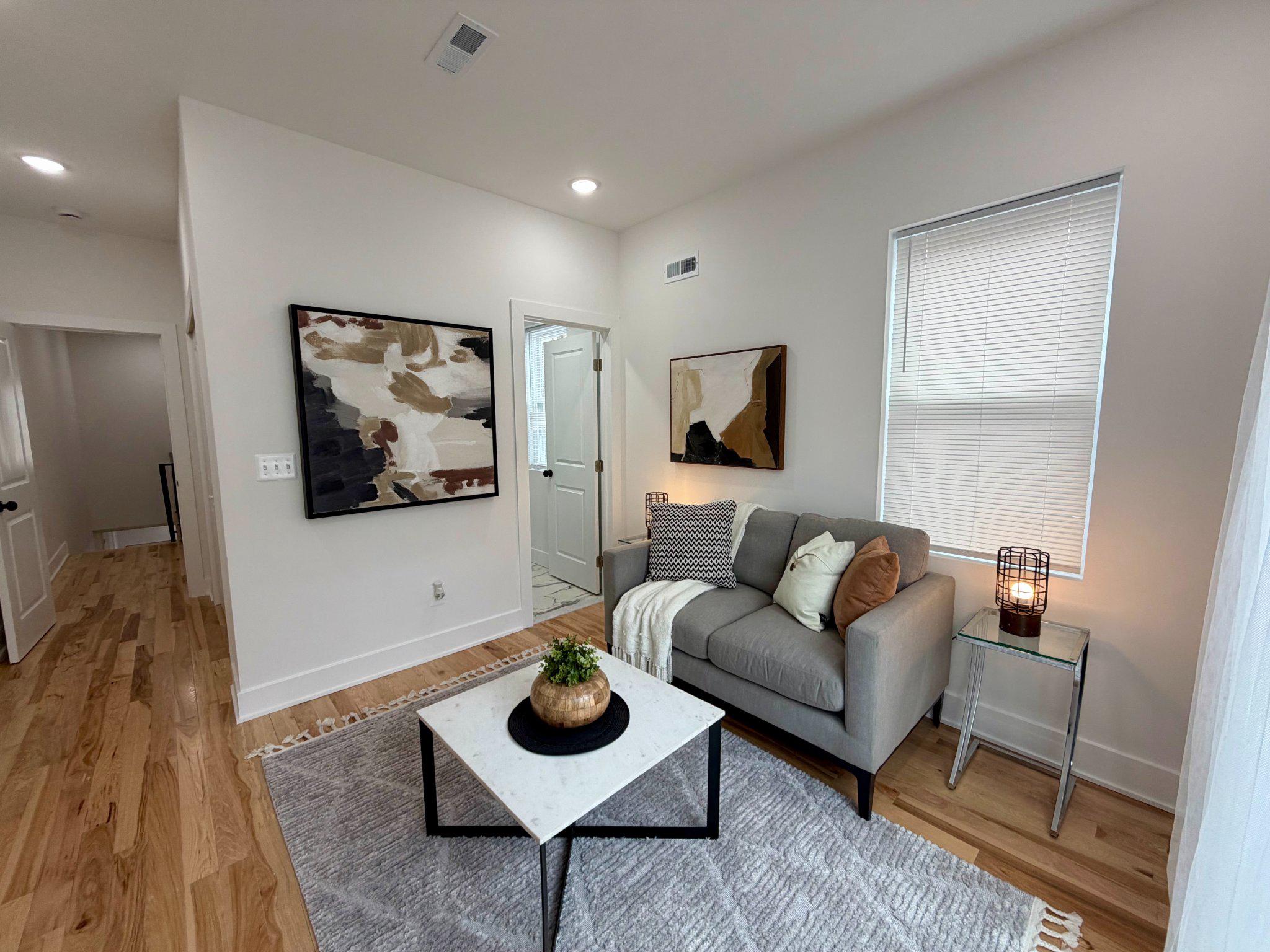 1314 South 46th Street Philadelphia, PA 19143 - Photo 47 of 56 a living room with furniture and a flat screen tv
